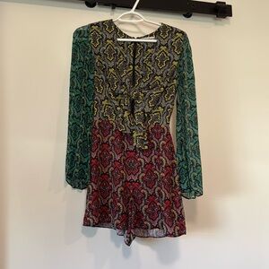 Used short romper 
Zipper in back 
Bell sleeve
Tie in front 
Cut out in front